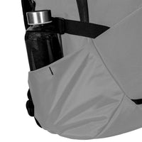 Gray backpack with a water bottle in its pocket on a white background