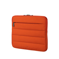 Orange quilted laptop sleeve with a zipper on a white background